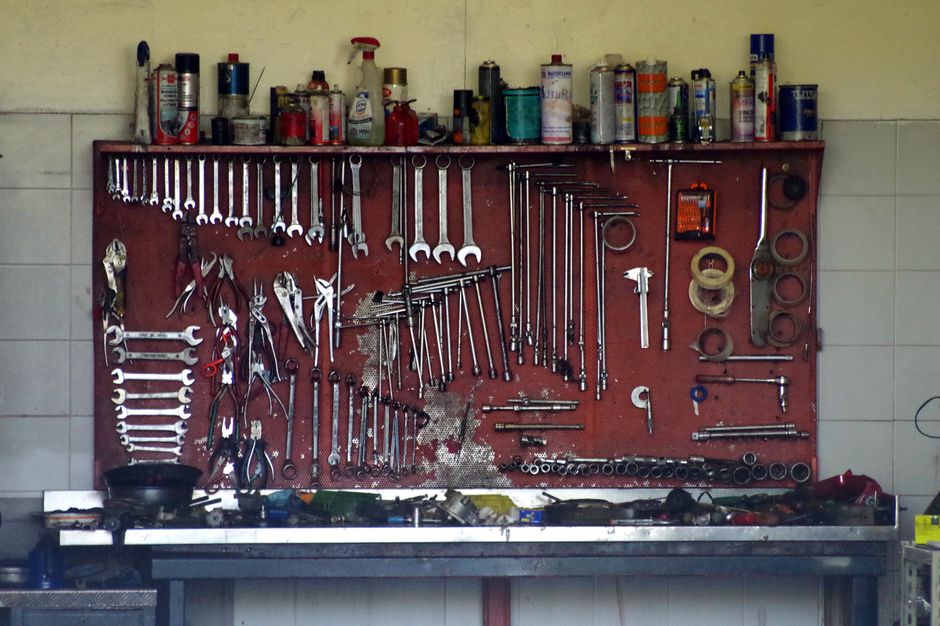 A neatly organized set of workshop tools on a pegboard, perfect for mechanic or DIY use.